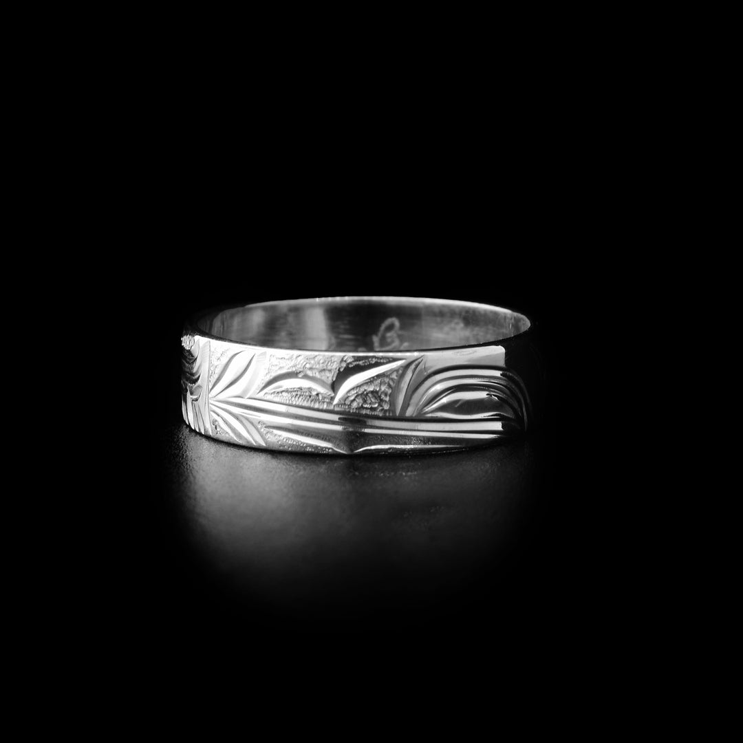 Sterling silver hummingbird ring with hand-carved hummingbird head and background designs. By Kwakwaka’wakw artist Cristiano Bruno.
