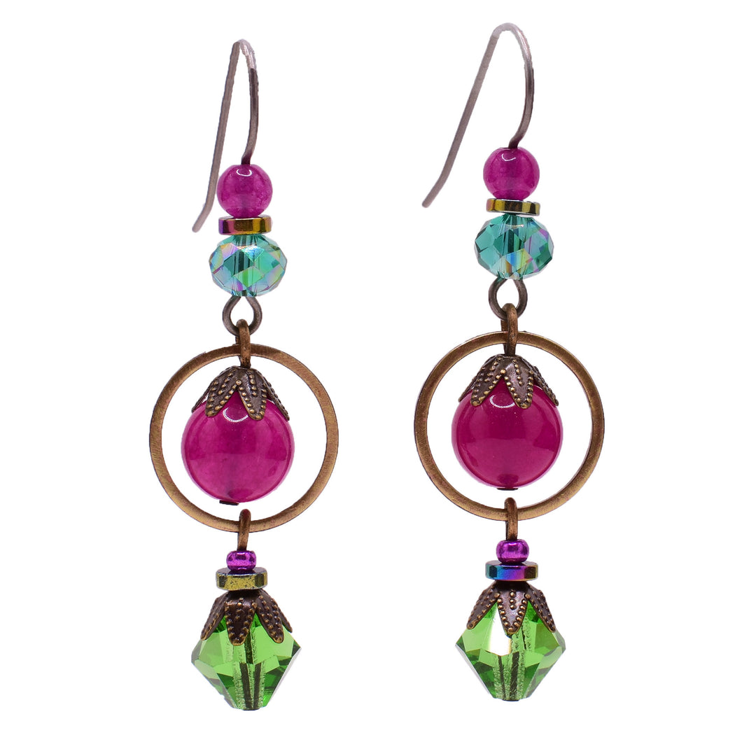 Vibrant dangle earrings made of Austrian crystal, handworked brass, hematine, glass and quartz. Titanium ear hooks. By Honica.