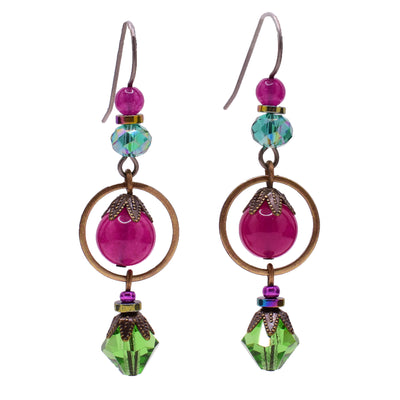 Vibrant dangle earrings made of Austrian crystal, handworked brass, hematine, glass and quartz. Titanium ear hooks. By Honica.