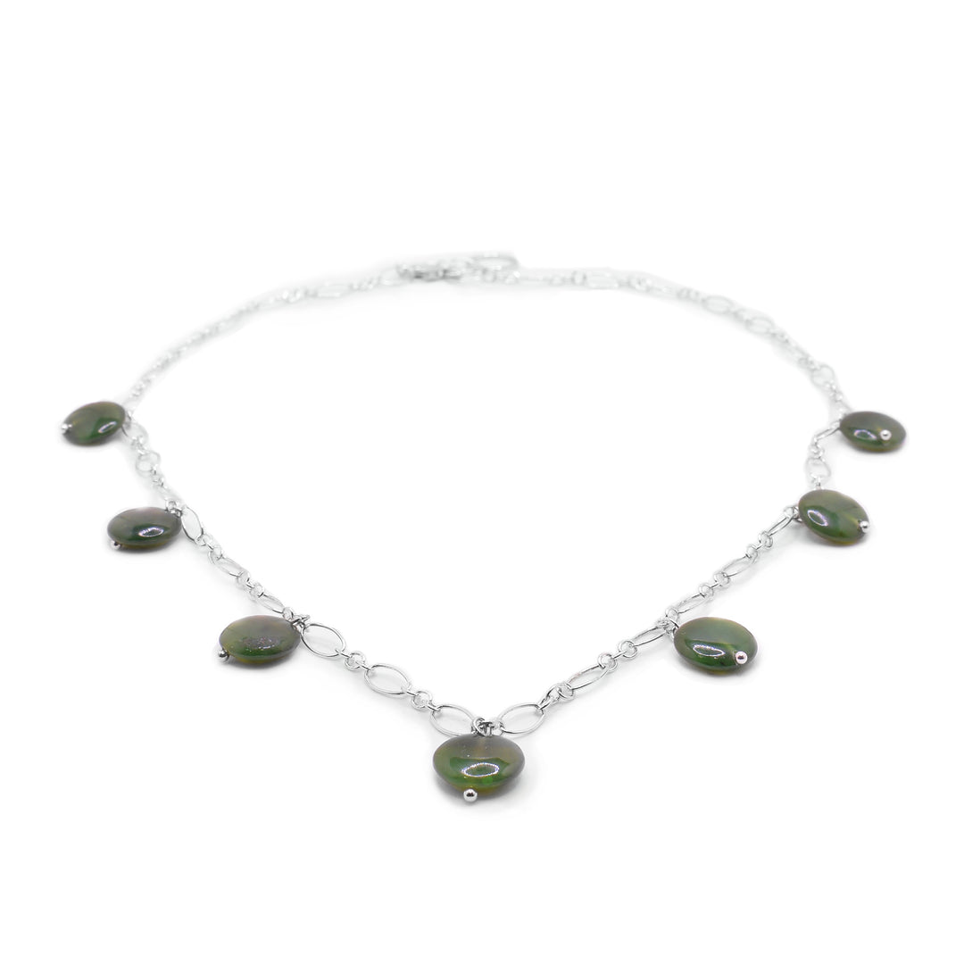 this Dainty Silver Jade Chain NecklaceHandcrafted BC Jade sterling silver necklace by our in-house artist. Features seven polished, deep-green jade beads. 