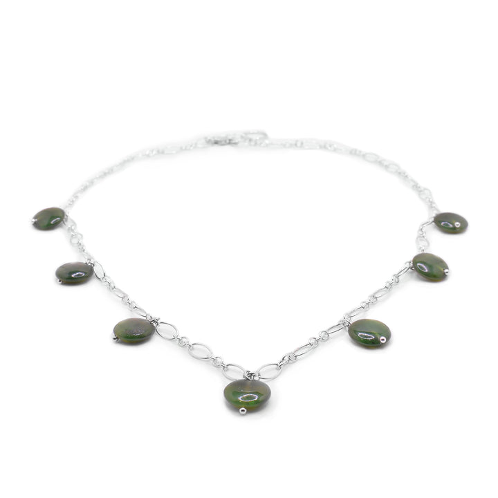 this Dainty Silver Jade Chain NecklaceHandcrafted BC Jade sterling silver necklace by our in-house artist. Features seven polished, deep-green jade beads. 