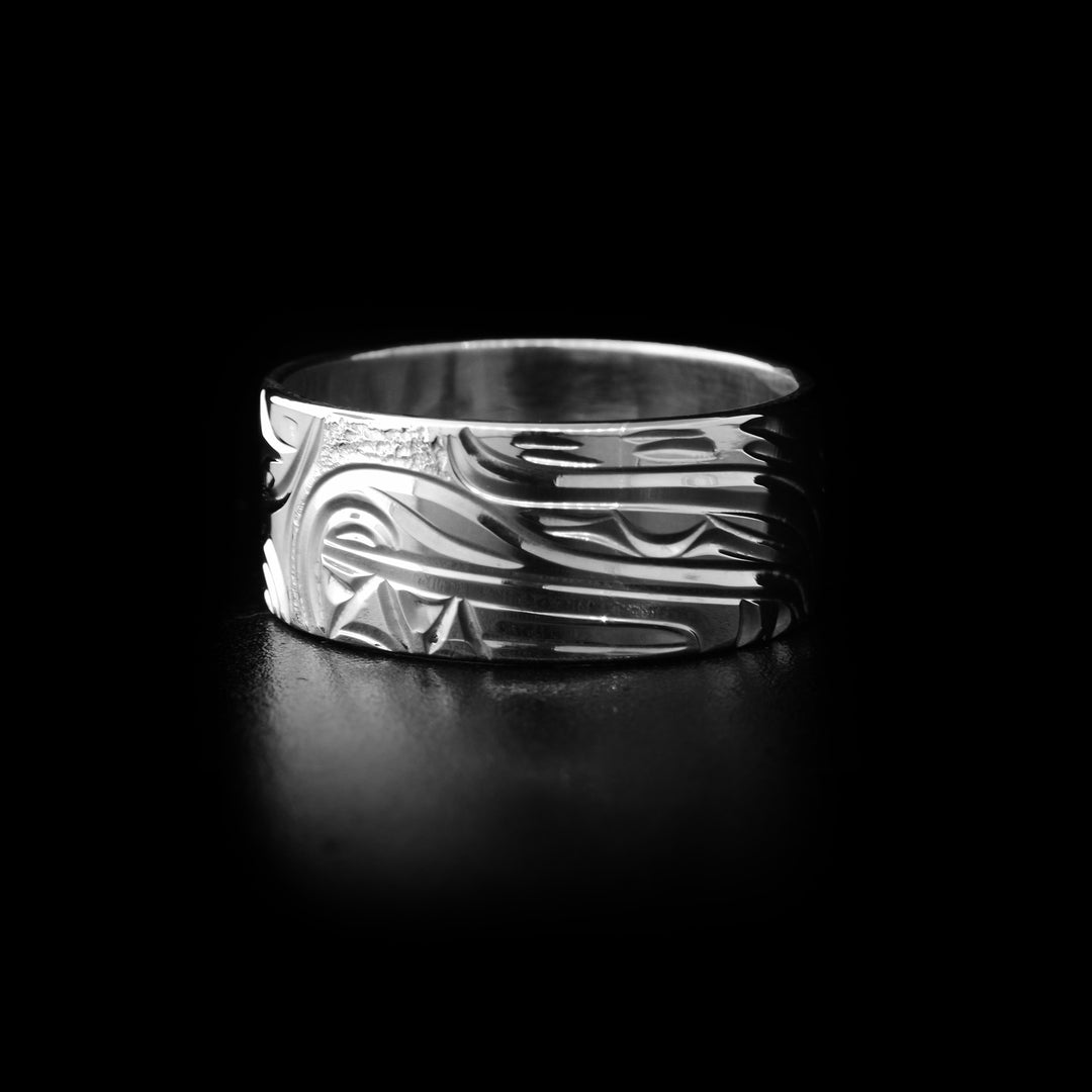 Sterling silver bear ring with hand-carved bear head and background designs. By Kwakwaka’wakw artist Cristiano Bruno.