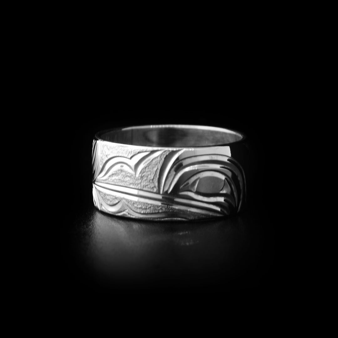 Sterling silver ring with hand-carved hummingbird head and background designs. By Kwakwaka’wakw artist Cristiano Bruno.