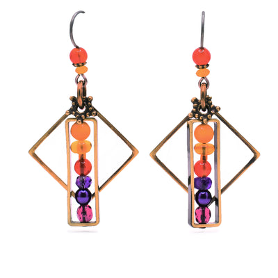 Dainty dangle earrings made of amber, amethyst, glass and carnelian agate. Titanium ear hooks. By Honica.