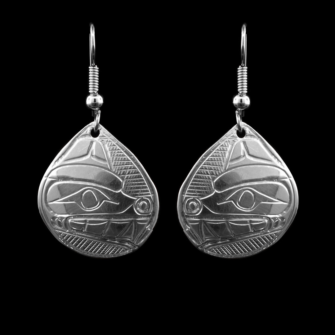 These tear drop sterling silver earrings have been hand carved with the image of the bears face carved into the earrings.