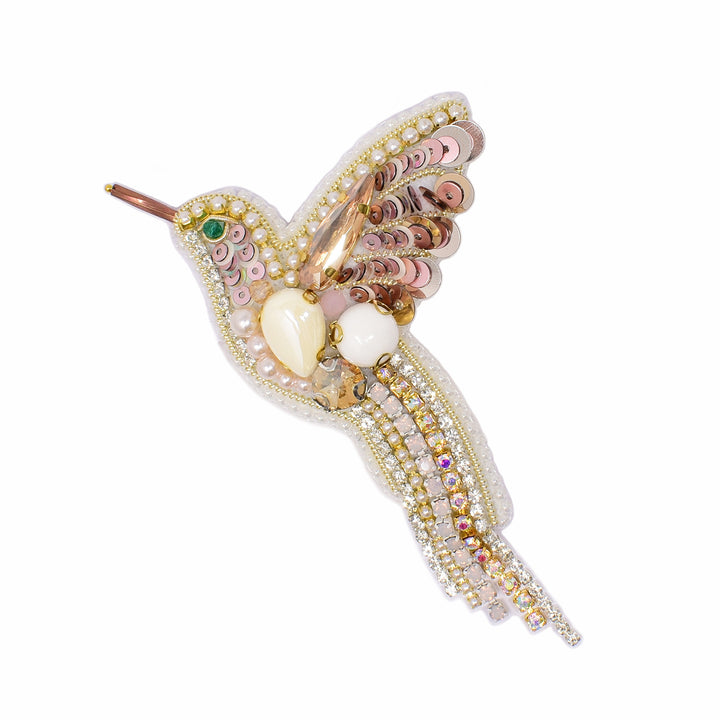 Large, beaded hummingbird brooch with crystals and sequins in mainly pinks and whites. By Ukrainian guest artist Zarmilka.