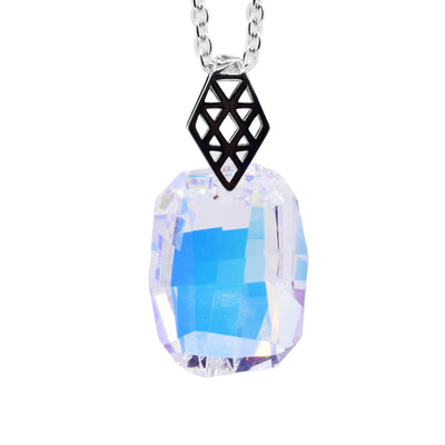 This Swarovski Crystal Aurora Borealis Pendant has a diamond shaped bail made from sterling silver with prismatic, cutout designs on it. The crystal hangs from the bail and has a chunky rectangular shape to it.