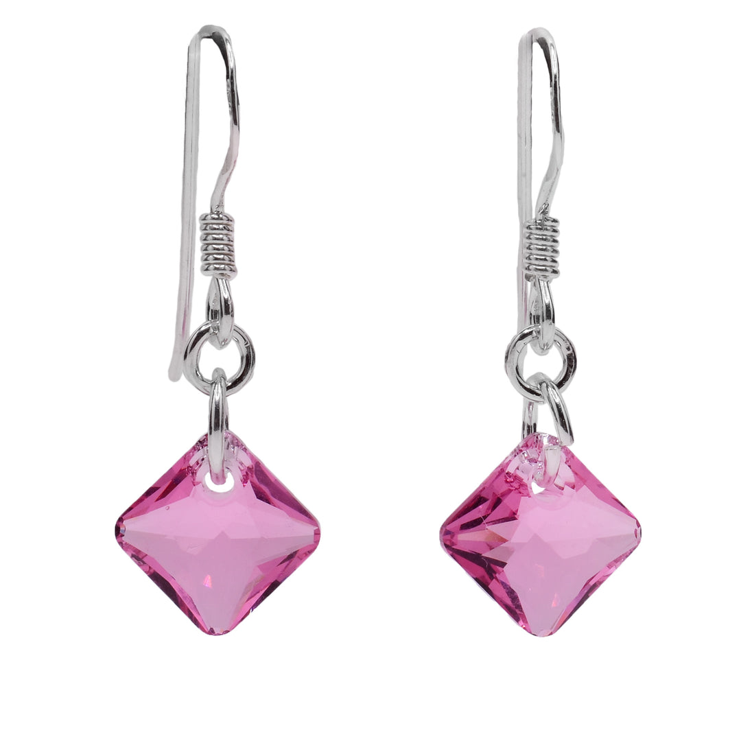 These pink crystal drop earrings have small, diamond shaped hangs made from light pink Swarovski crystals. The hangs are attached to long hooks with one chain link.