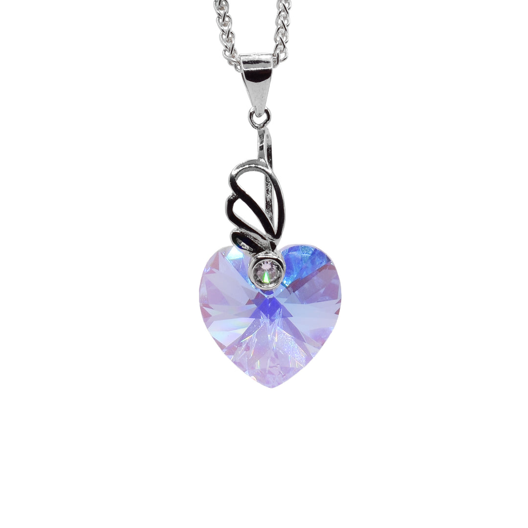This Swarovski crystal heart pendant is aquamarine colored. The pendant dangles from a wide jump ring and drops down from a long, sterling silver charm. There is a fan like designs from this charm at the top of the piece with a cubic zirconia gem held in it. The aquamarine crystal below the charm is heart shaped.