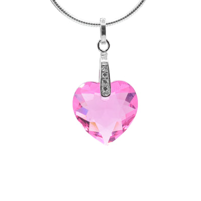 This pink heart pendant is made up of a heart shaped, pink rose Swarovski crystal as the pendant which hangs from a long, sterling silver bail. The bail attaches over top of the pendant and features three cubic zirconia gems displayed on it.