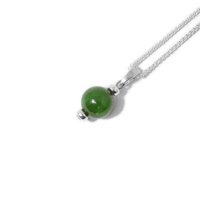 Round BC jade ball with small, thick sterling silver ring on top and bottom. Long silver bail.
