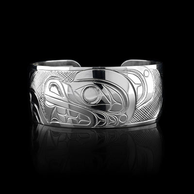 This Bear bracelet has a wide, sterling silver band with a gap in the back. There is a depiction of the Bear that is carved into the surface of the band.