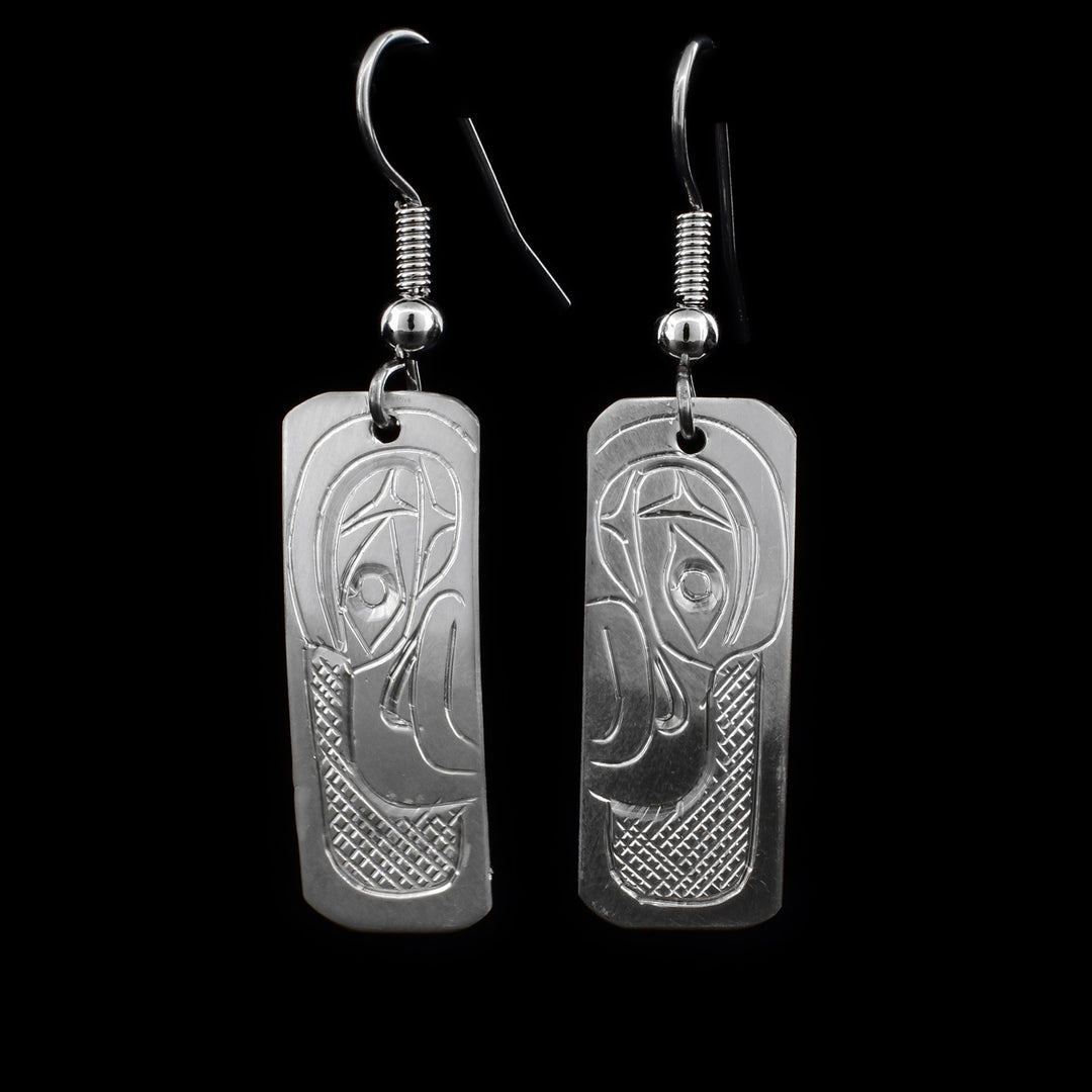 These sterling silver dangle earrings have rectangular hangs with depictions of the Eagle carved into them