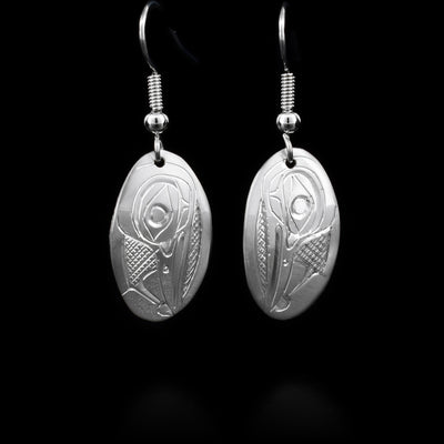 These sterling silver dangle earrings have small, oval hangs with the Hummingbird carved into them.