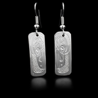 These sterling silver dangle earings have rectangular hangs with Ravens carved into them.