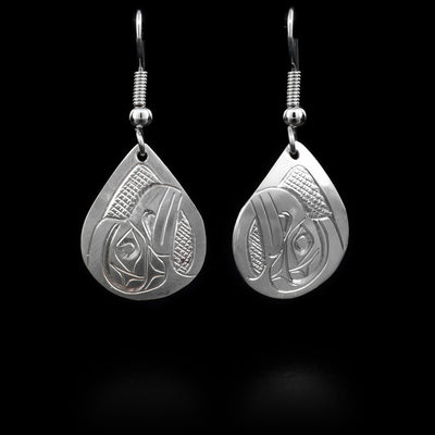 These sterling silver earrings have teardrop shaped hangs that depict the face of the Raven. They have silver hooks.