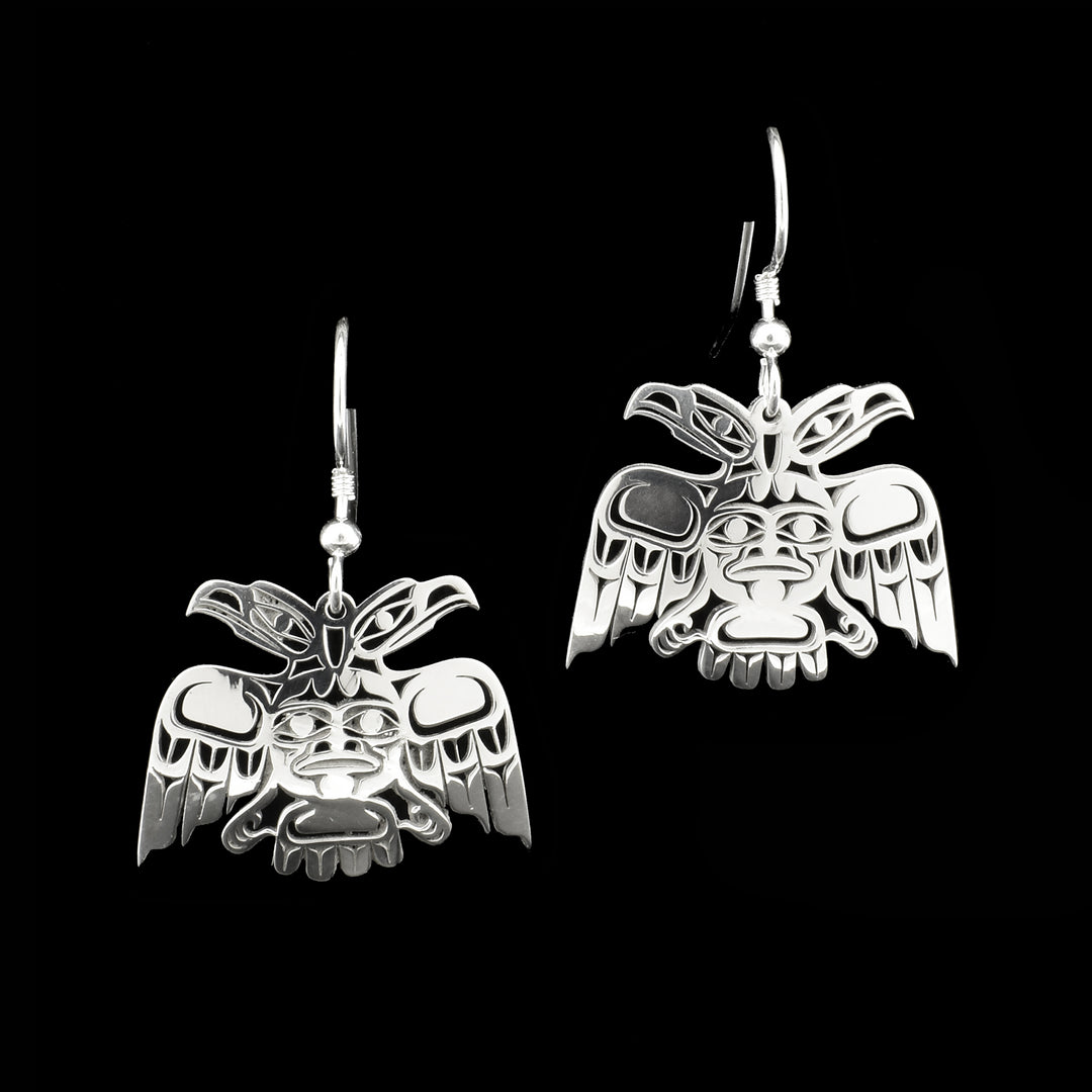 These unique, dangling Eagle earrings are made from sterling silver and have Eagle shaped hangs. The hangs have been cast to have designs that depict the Eagle, each Eagle is depicted having two heads.