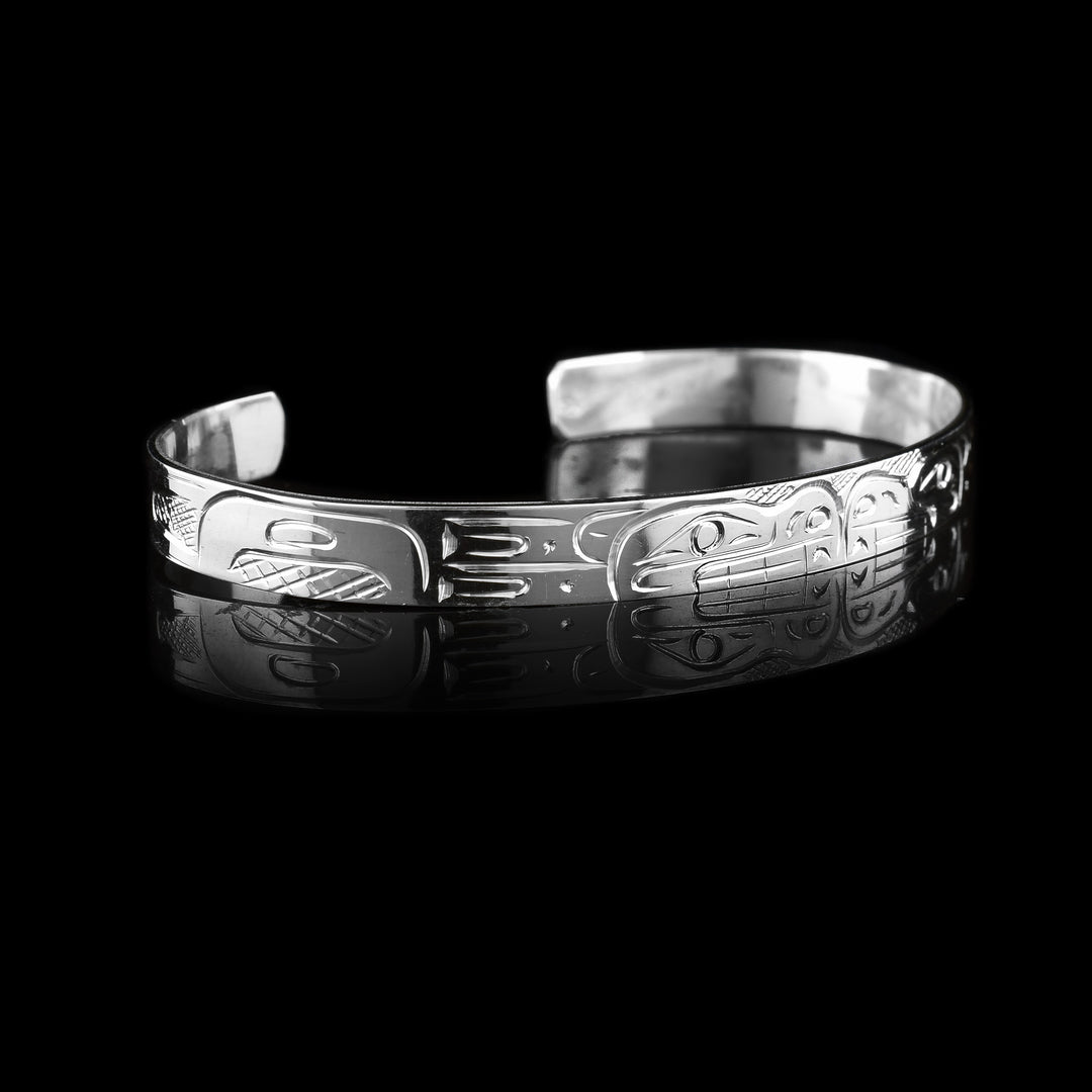 This Double Bear Cuff Bracelet has the indigenous carvings on the surface of this thin sterling silver bracelet/