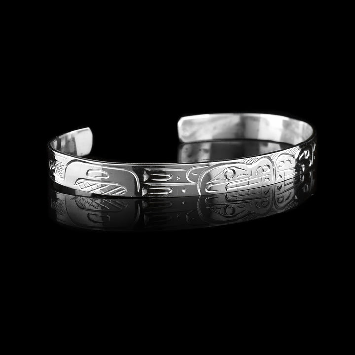 This Double Bear Cuff Bracelet has the indigenous carvings on the surface of this thin sterling silver bracelet/
