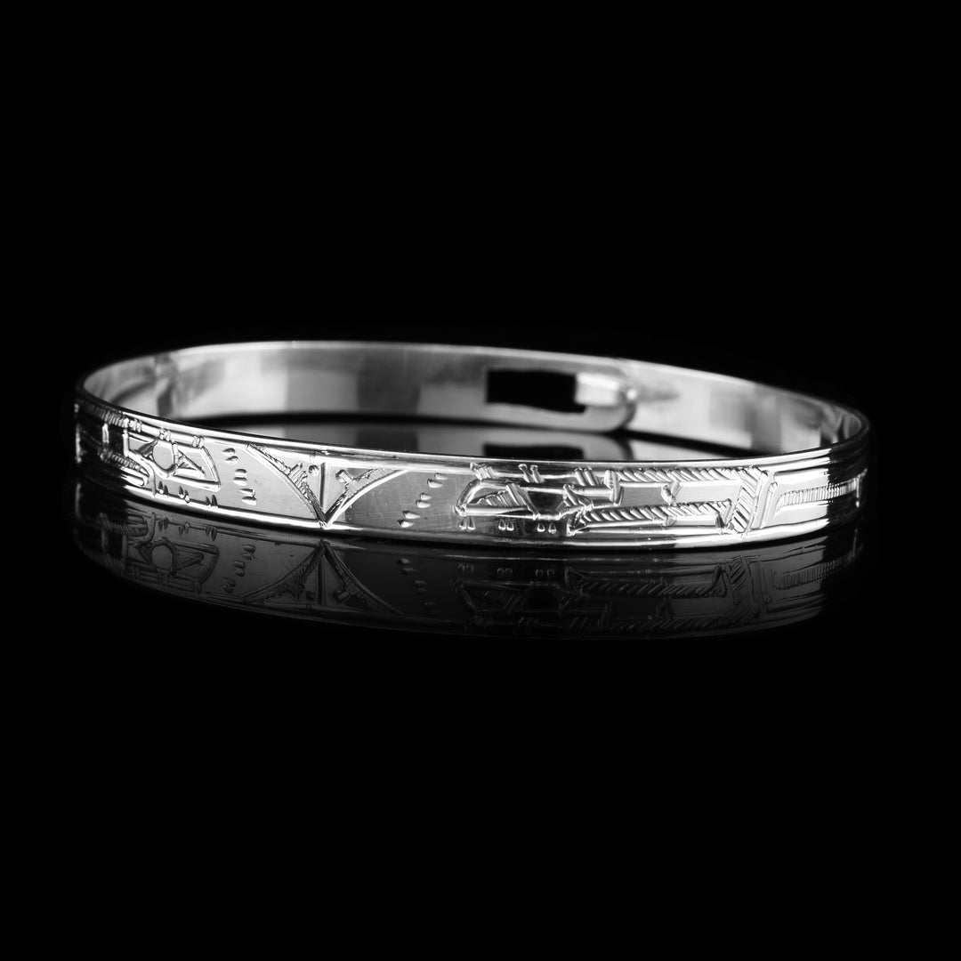 Double Eagle Clasp Bracelet, two Eagle heads carved indigenous style into this small sterling silver bracelet. 
