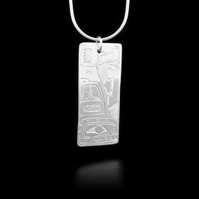Rectangular sterling silver pendant featuring orca. Cross-hatching background. By Coast Salish artist Jeffrey Pat.