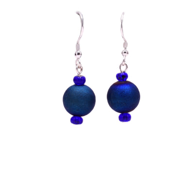 Round, dark blue dyed agate beads with little dark blue glass beads above and below. Sterling silver hooks.
