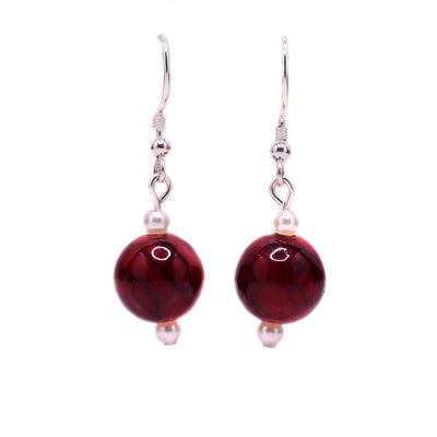Round, dark red dyed quartzite beads with little white pearl beads above and below. Sterling silver hooks.