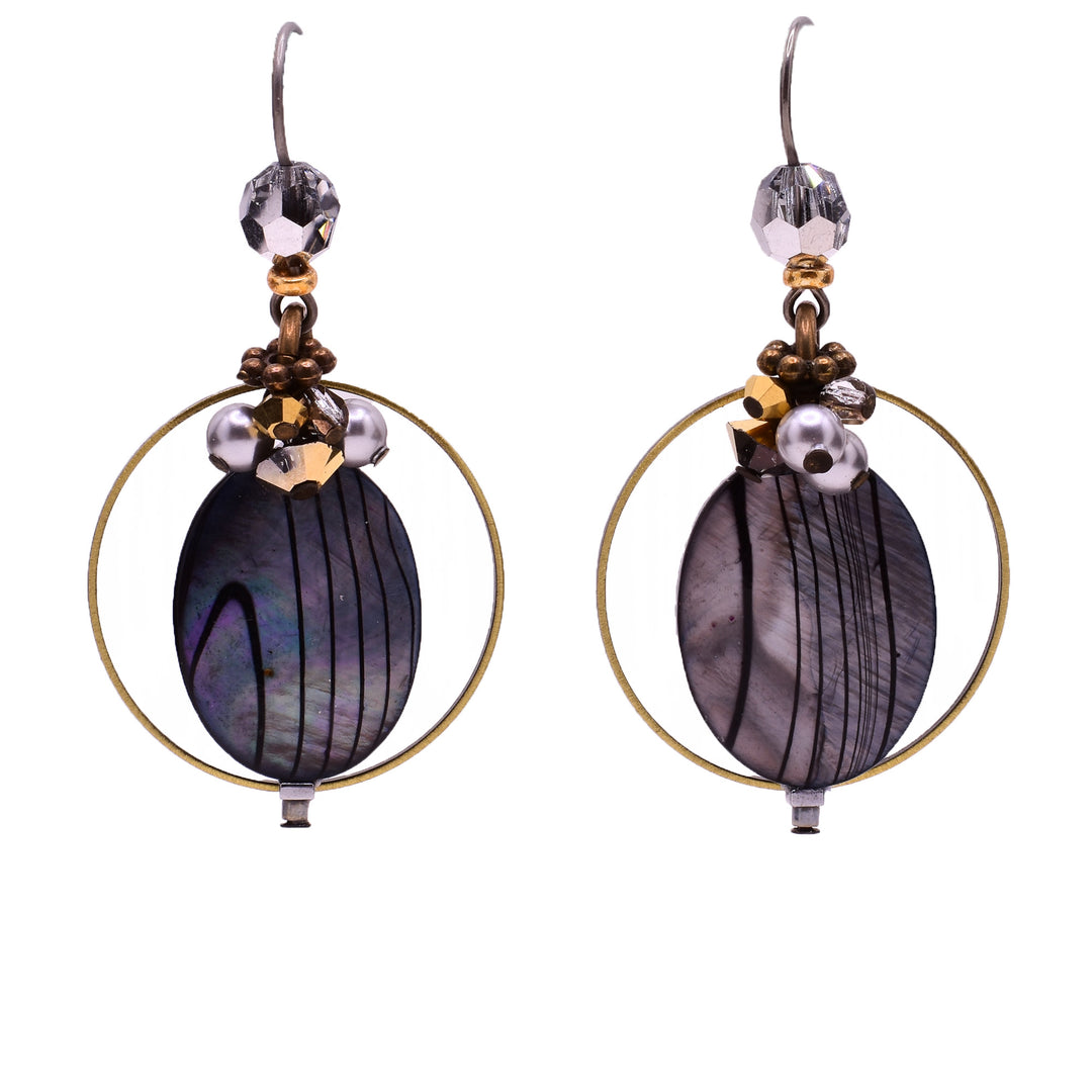 Dangle earrings made of Austrian crystal, handworked brass, glass and dyed shell. Titanium hooks. By Honica.