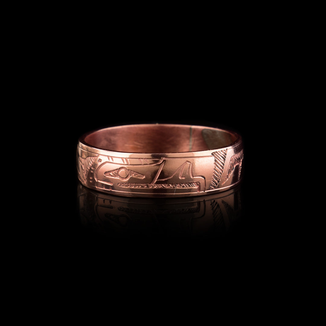 The quarter inch wide  Eagle Copper Band Ring is handcarved with the indigenous legend of the Eagle around the band.
