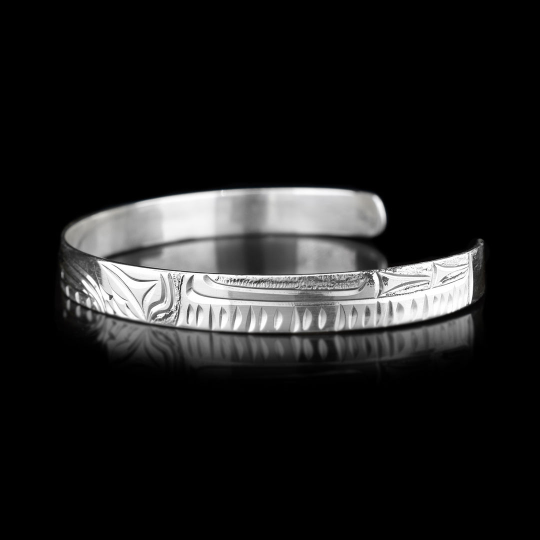 Right angle photo of the cuff bracelet has identical carvings to the other side.