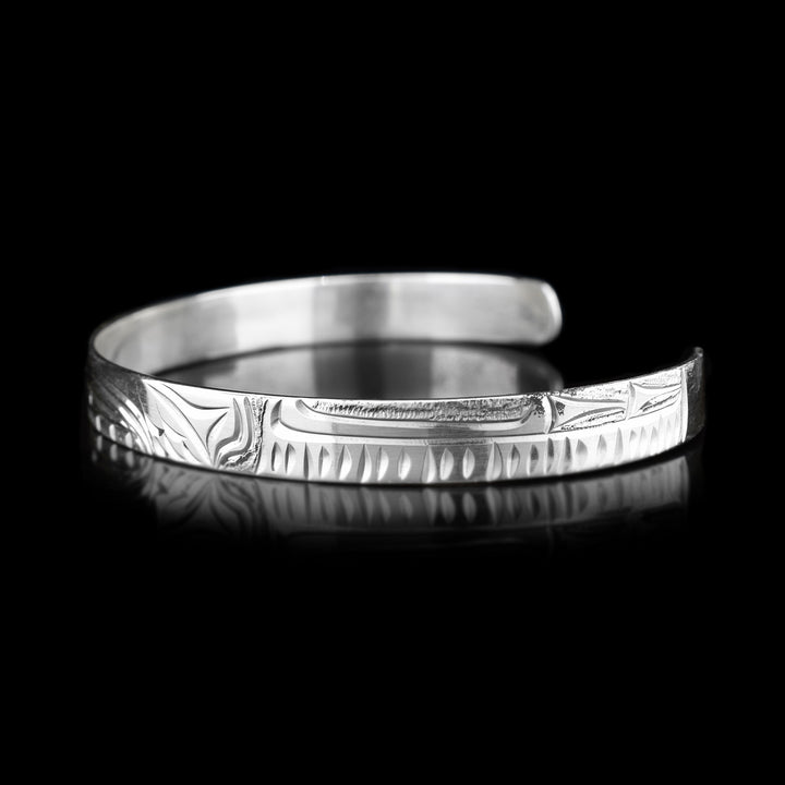 Right angle photo of the cuff bracelet has identical carvings to the other side.
