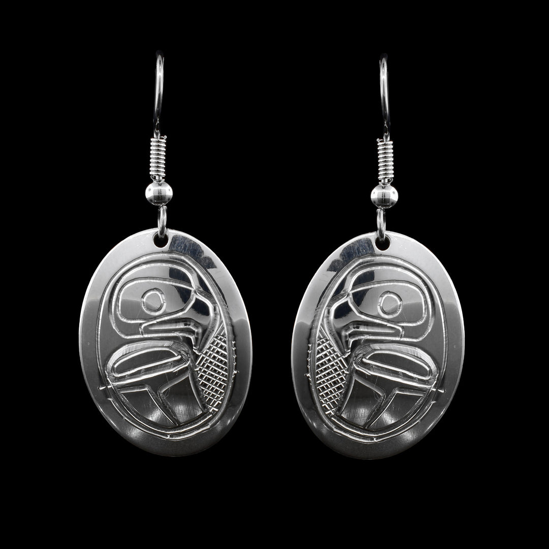  Eagle Sterling Silver Earrings. These dangle earrings are hand carved the the face and body of the eagle into the oval earrings.