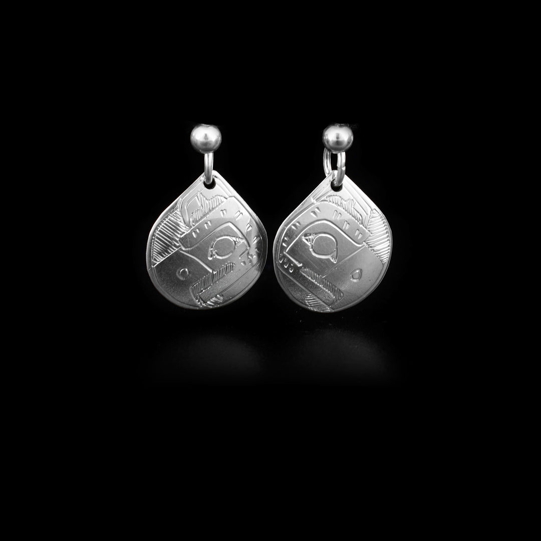 Sterling silver stud dangle earrings that have a teardrop-shaped hang connected to the stud with a jumpring. The hang depicts the face of the Eagle. 