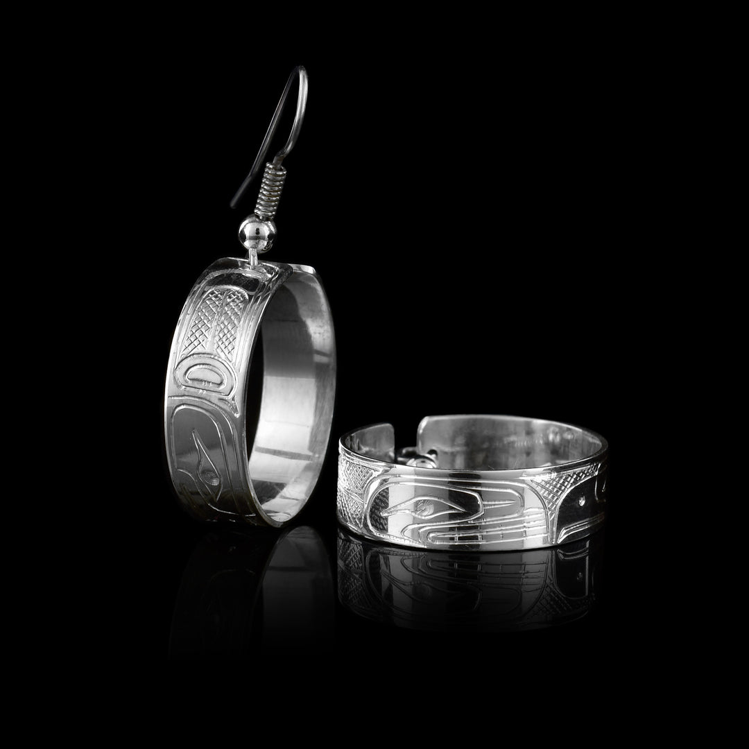 Artina's sells hand carved and crafted earrings with the Eagle and Orca legend caved onto the sterling silver dangle hoop earrings.