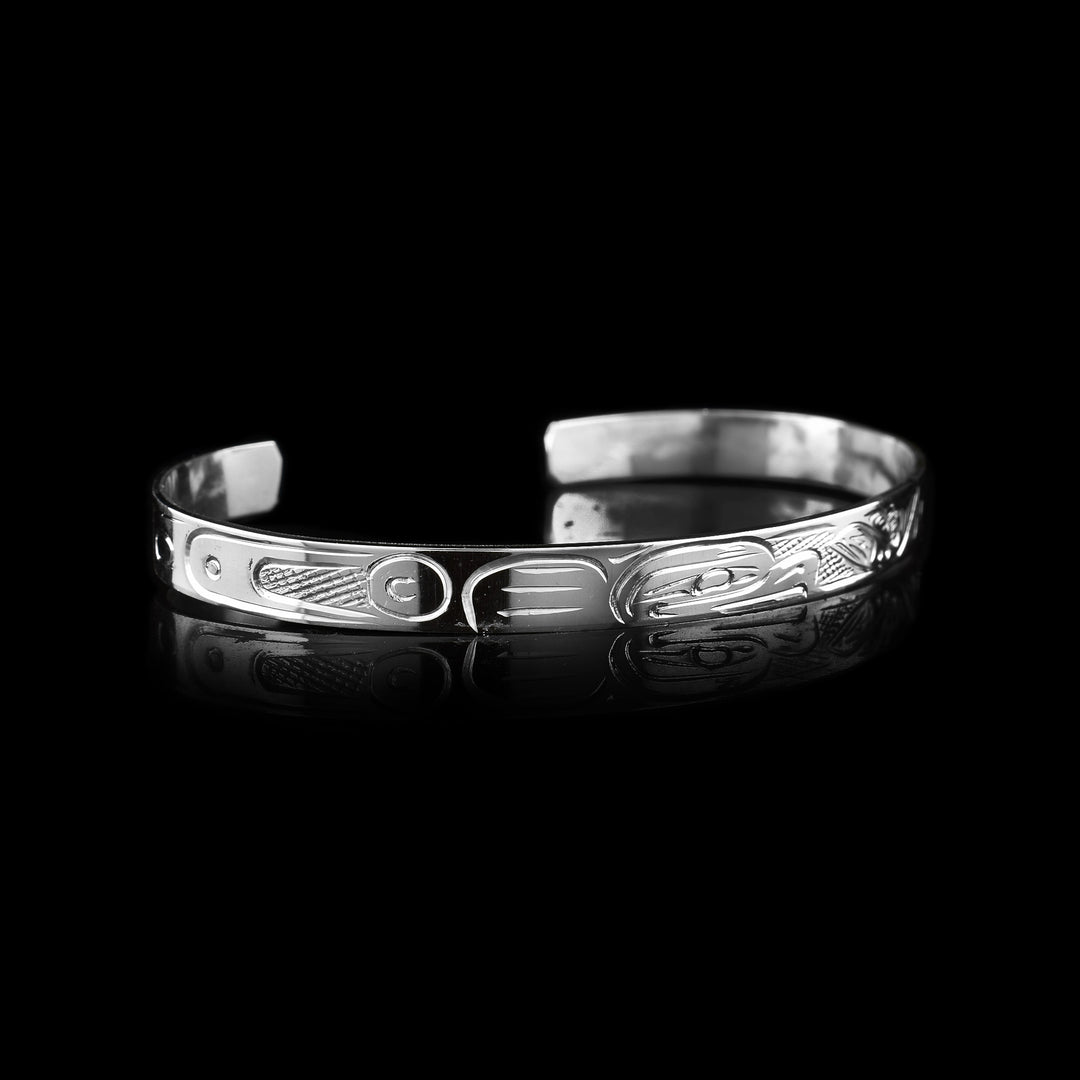 Eagle and Salmon Cuff Bracelet - The legend of the Eagle and Salmon are carved onto the surface of the sterling silver thin cuff.