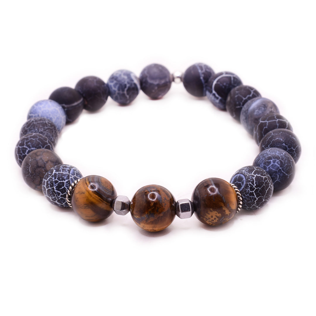 This beaded agate bracelet has large, sphere shaped agate beads that are sperated by hematite and sterling silver beads. There are also large tiger's eye beads that are in a small section of the piece.