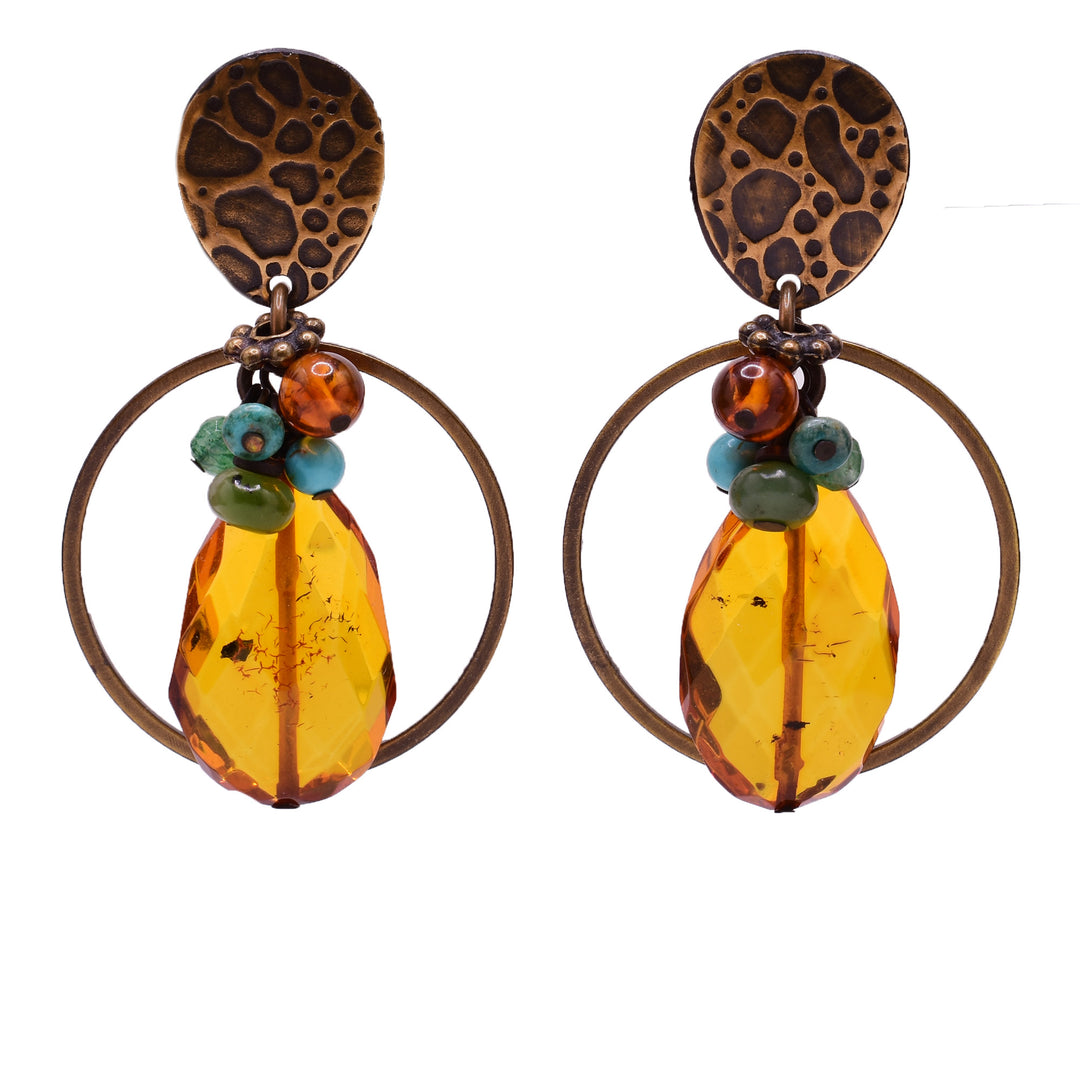 Dangle stud earrings made of Russian amazonite, handworked brass, turquoise, baltic amber and jade. Titanium ear posts. By Honica.