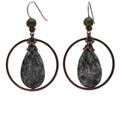 Dangle earrings made of seraphinite, BC jade and handworked brass. Titanium ear hooks. By Honica.