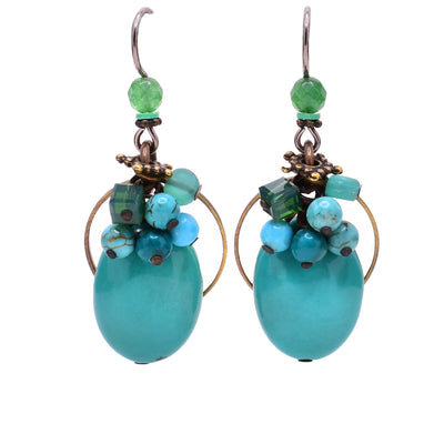 Dangle earrings made of Austrian crystal, handworked brass, turquoise, aventurine and magnesite. Titanium hooks. By Honica.