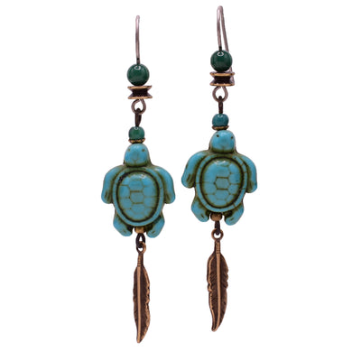 Dangle drop earrings made of aventurine, handworked brass, and resins. Titanium hooks. By Honica.
