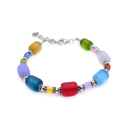 This bracelet with glass beads is made using sterling silver and tumble glass beads. The beads are colorful, round and there are small silver beads accenting the piece.