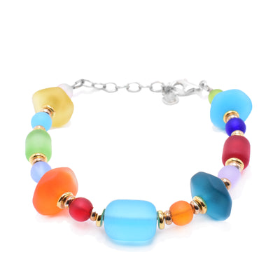 This colorful glass bead bracelet has beads of various sizes, shapes and colors. The chin is made from sterling silver and has silver and 14K gold fill beads between the glass ones.