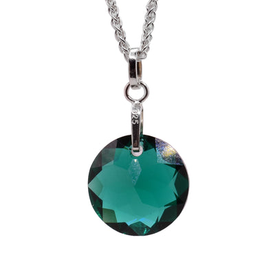 This Swarovski crystal pendant features an emerald green Swarovski crystal with a silver bail.