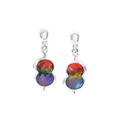 These sterling silver dangle earrings have hangs shaped like an infinity symbol. The hangs are made by setting ammolite gemstones on a silver back.