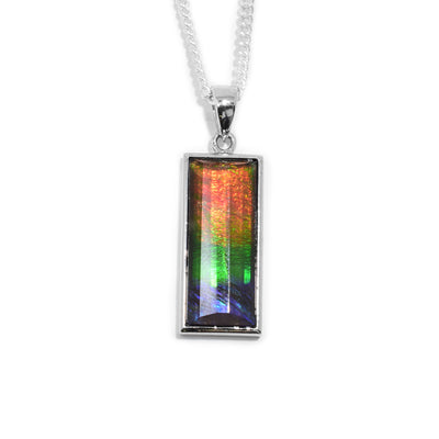 This ammolite pendant is rectangular and have a beautifully cut, ammolite gem set onto a sterling silver back.