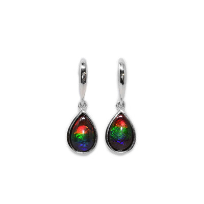 These teardrop earrings are made from ammolite gemstones and sterling silver. The piece has hangs made from teardrop shaped ammolite gems embedded into silver.