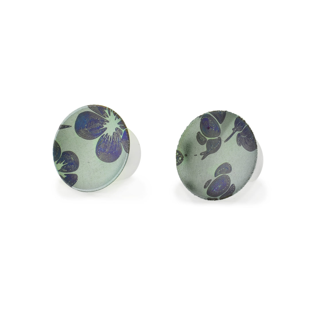 hand-crafted titanium flower stud earrings by artist Patrick Briggs. Featuring a unique concave design and intricate floral patterns, these lightweight, hypoallergenic studs are the perfect for sensitive ears.