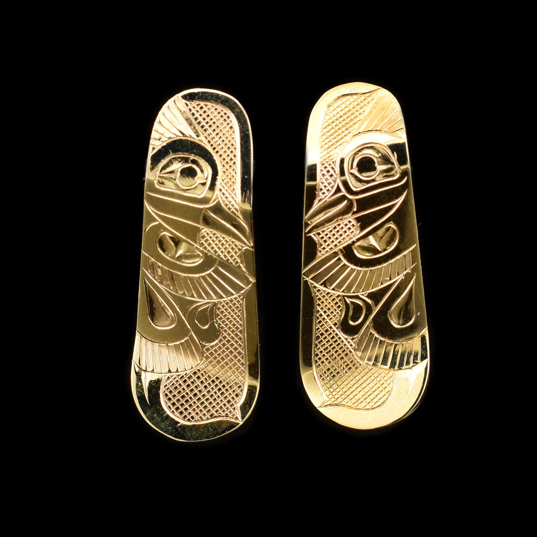 These 14K gold earrings are stud earrings with the surface of the earring extending past the earring. There are depictions of the Kingfisher carved into the surface of the earrings.
