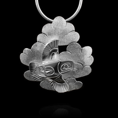 This Eagle pendant is made from sterling silver. There  are several clouds attached together and there is an Eagle that has been mounted onto the pendant.