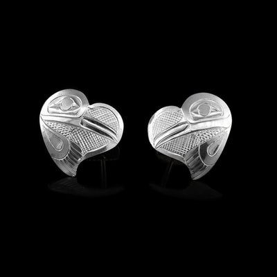 These Hummingbird earrings are made from sterling silver. These stud earrings are heart shaped and there are depictions of the Hummingbird carved into the surface of them.